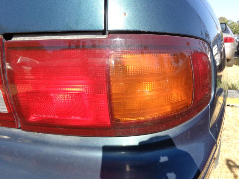 Passenger rear tail light lens 95 96 toyota camry turquoise 4 dr sedan 2.2 oem