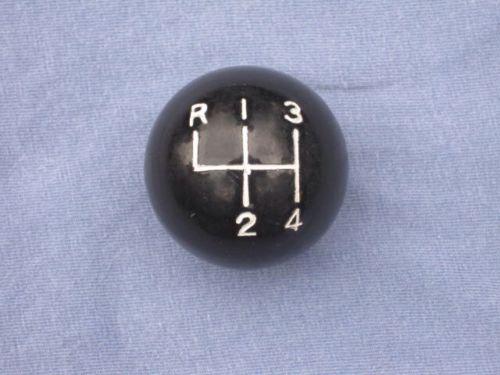Black shift knob accessory with 4 speed shift pattern