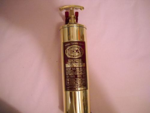 Vintage general quick-aid brass fire extinguisher with bracket
