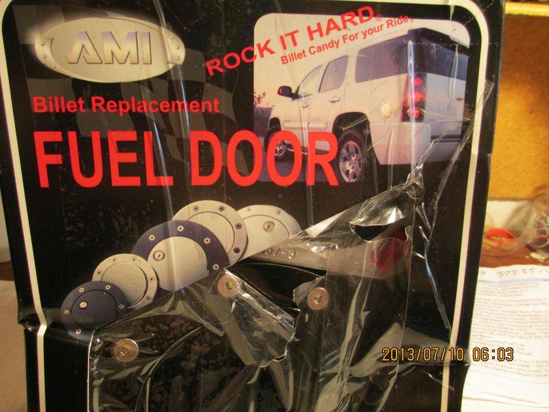 Ami race style billet fuel door; gloss black ring/door; non locking, p/n6057gk 