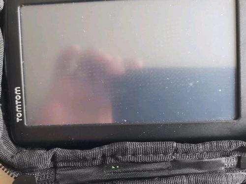 Tom tom sat nav with heavy dashboard fabric stand and case