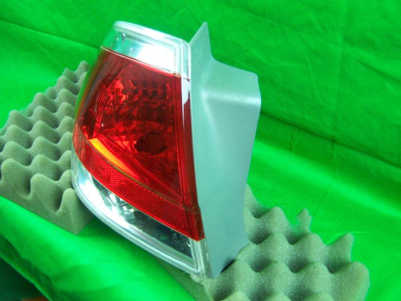 Sell USED 2008 FORD FOCUS OEM LEFT SIDE TAIL LIGHT WITH CHROME BEZEL