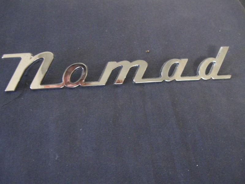 "nomad"        emblem  badge script trim    metal   boat? nice