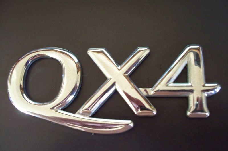  infiniti qx4 97-03 rear liftgate emblem oem   ( looks nice )