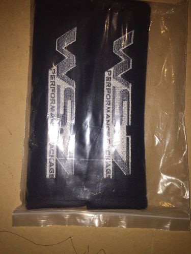 Black embroidered seat belt pads or cushions for a pontiac trans am