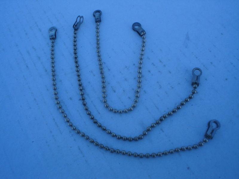 Gas fill cap safety chains