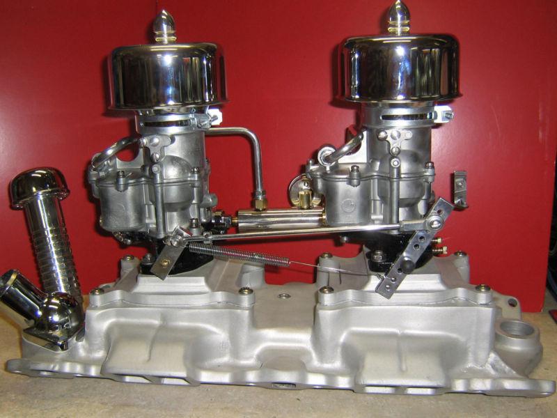 Sbc 2x2 on smooth flowing  offenhauser 2x4 intake with big 2110 holley carbs