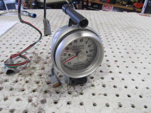 Nascar auto meter tac 0-11k with mount and auto-meter quick-lite