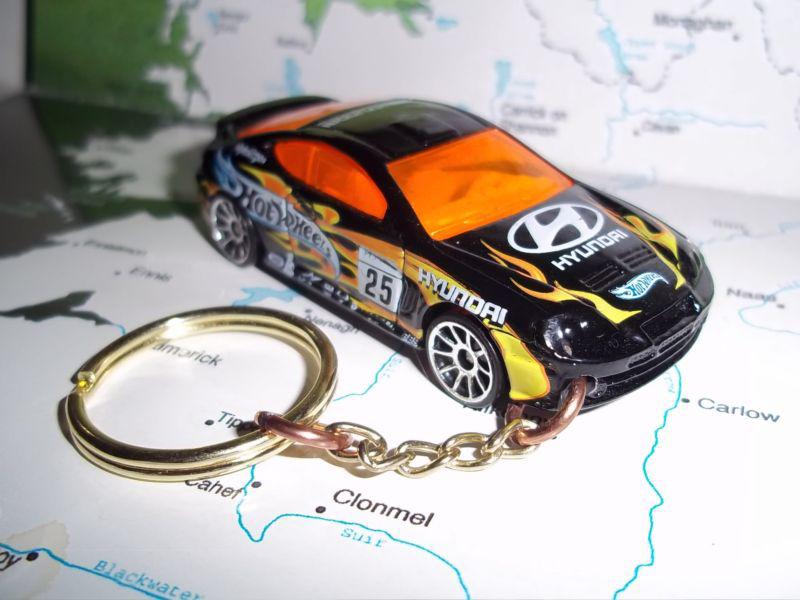 Custom mint keychain 2000's hyundai tiburon,black w/chrome mags