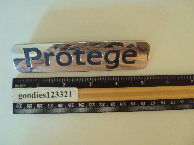 Mazda protege chrome emblem used 5 1/4" x 1 1/4"