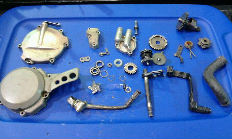 Kawasaki kx 80/85 engine cases , flywheel ,cdi box , cylinder head & many other 