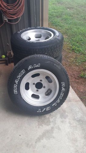 4 western slotted 4 lug wheels with new grandam white letter tires