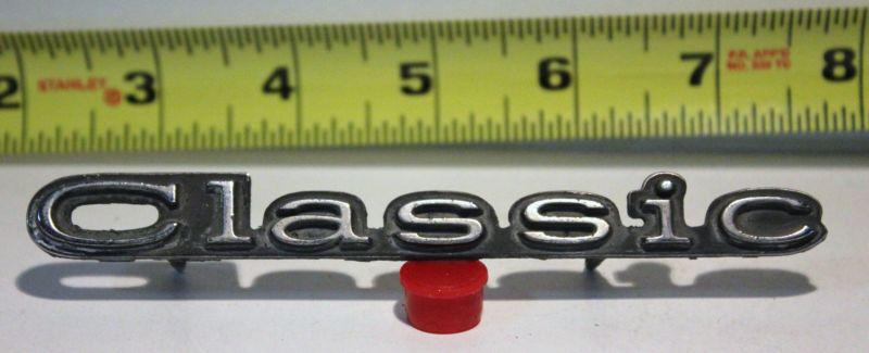 Old car emblem classic removed from junked car many years ago