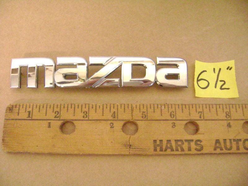 Mazda chrome plastic emblem 6 1/2" long  2 1 7 cx rx 3 miata