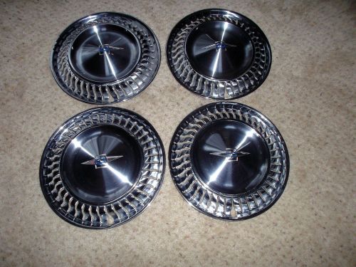 1960 chevrolet corvair hubcaps (4 in all)