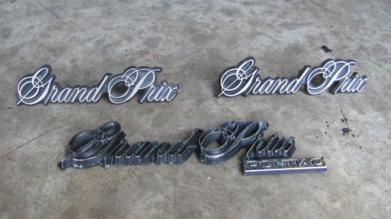 1981-1987 pontiac grand prix emblem set oem badges x3 fenders + trunk lid 85 86 