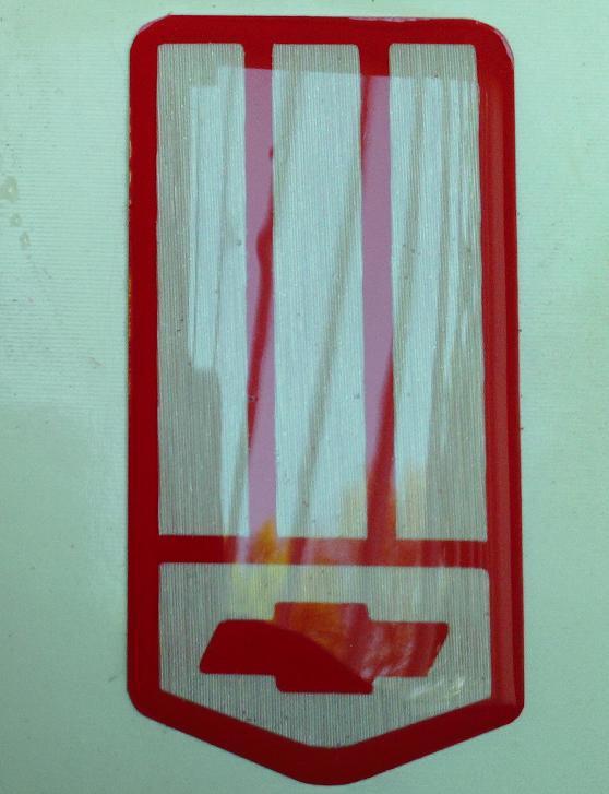 93-02 camaro red & brushed steel look, self adhesive nose emblem front bumper