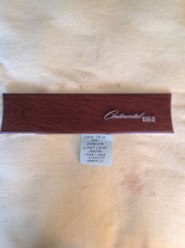 Metal dash trim and emblem.