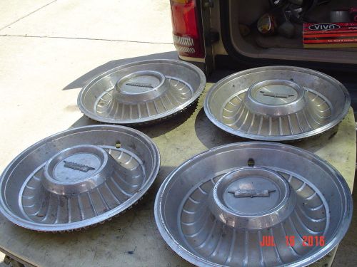 Vintage hubcaps 1957 cadillac original full set