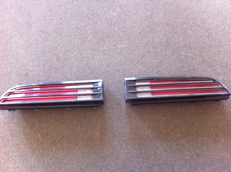 1977 pontiac trans am tail light bezel, lens and side marker.