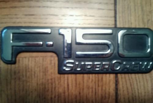 Used oem ford f-150 super crew pickup emblem yl-34-8442528