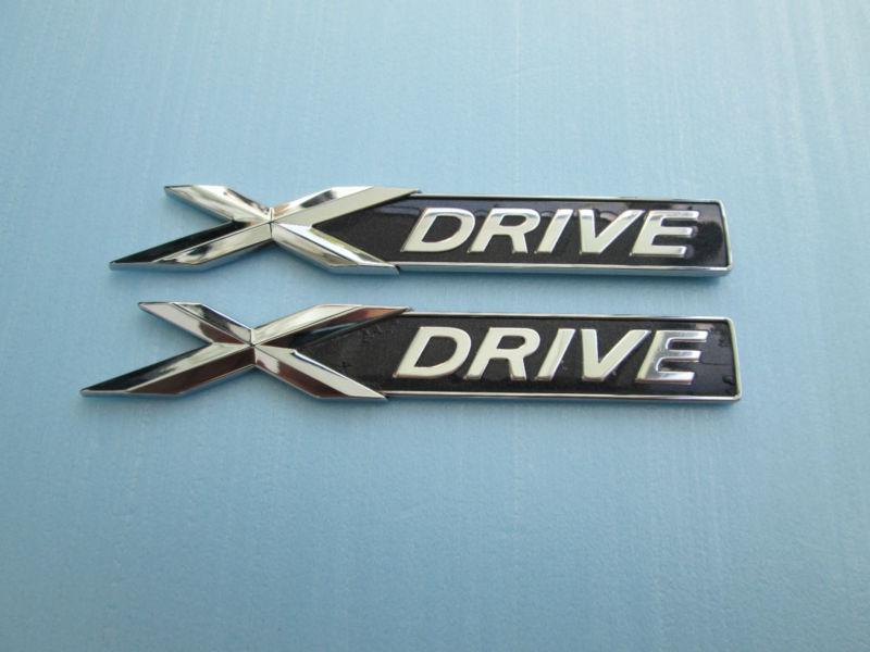 Bmw x-drive emblem decal pair two used oem factory genuine