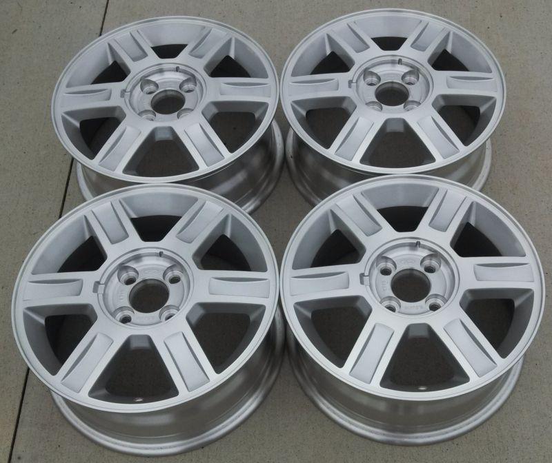 Mercury cougar  wheels factory set of 4 genuine 16" fits focus also