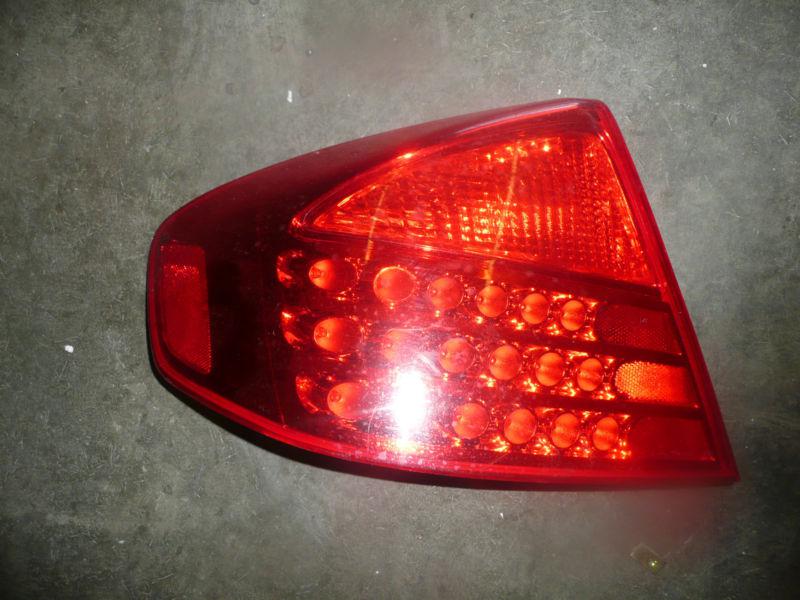 03 - 05 infinity g35  drivers side tail light with bulbs  oem