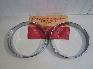 Nos 1954 ford car headlight bezels...new original fomoco pair