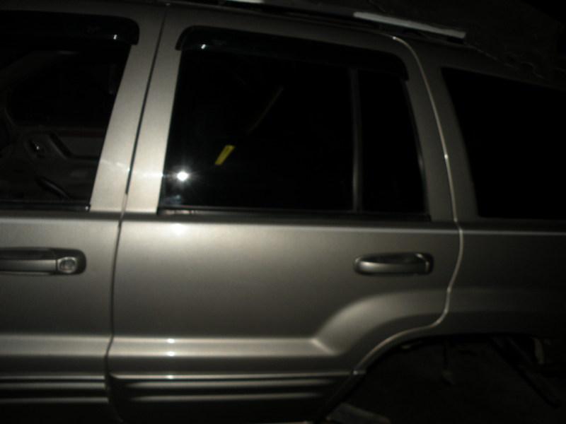 #3098  1999-2004 jeep grand cherokee left rear door  assembly   oem  paint ps4