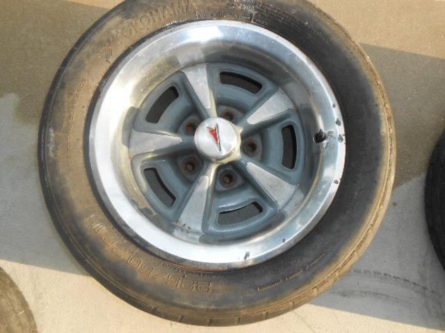 Pontiac gto rally wheel with the trim ring and center cap .15 inch...b