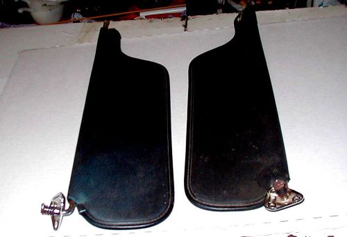 Two black vinyl pickup sunvisors.  maybe either a 70&#039;s ford or chevrolet