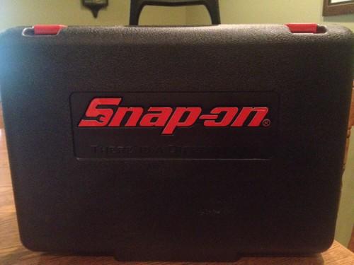 Snap-on cordless power impact wrench kit with travel case