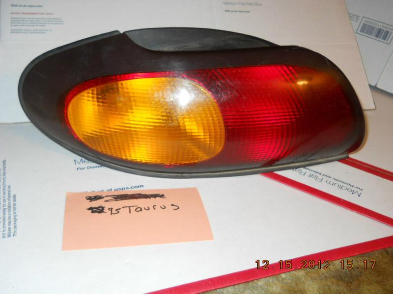 96 97 ford taurus lh driver side rear brake tail light turn signal red/yellow 