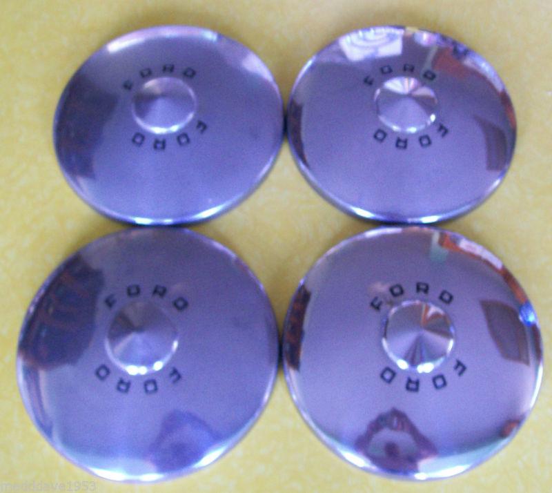 Four used ford hub caps 1949-1950, 