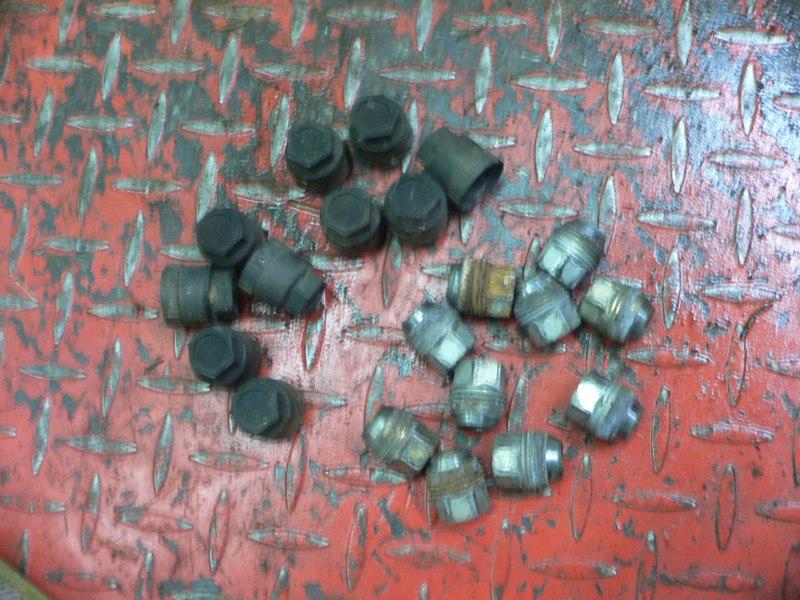 Sell 84 Pontiac Fiero Lot of 10 Lug Nuts with Plastic Caps Covers in