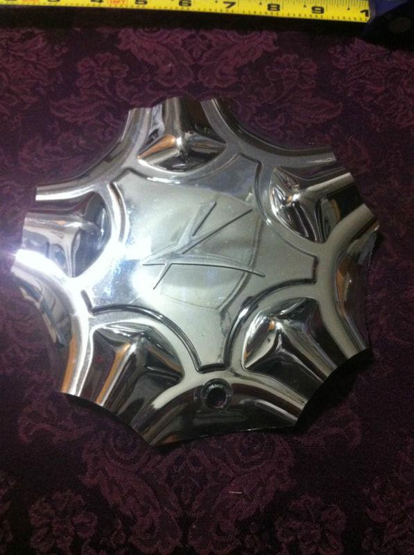 1 aftermarket chrome center cap    part# 10865 (rev.f)
