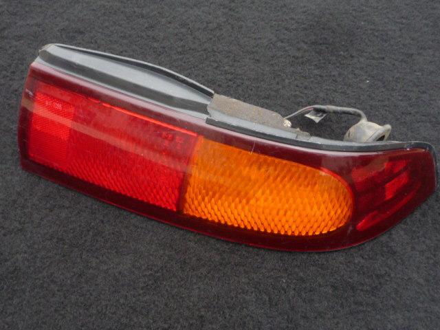 Taillight (lens & housing) assembly genuine nissan product for a 240sx 1995-1998