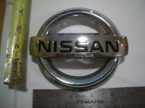 Nissan round black emblem symbol used bagde chrome oem original