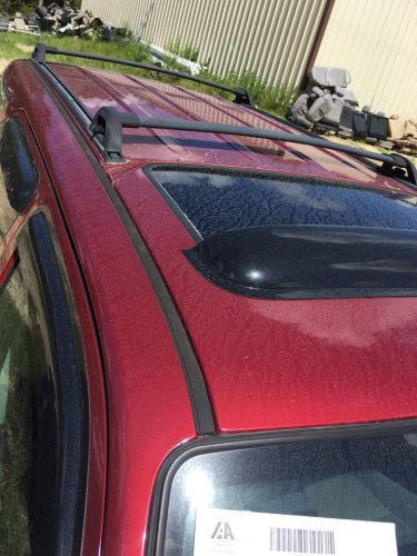 Ford escape 2005 roof rack complete with cross bars.