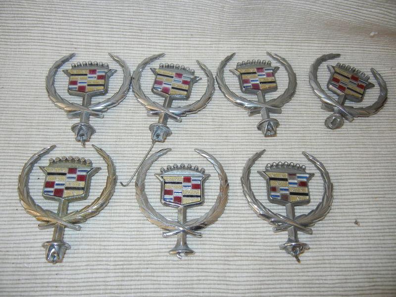 Lot of 7 vintage cadillac fleetwood brougham automobile hood emblems 1994-97