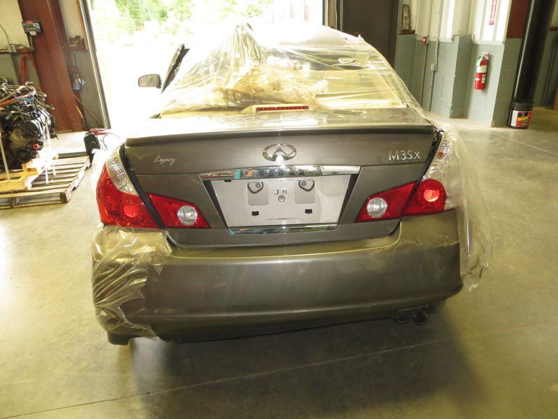 Driver side (left) tail light for a 2007 infiniti m35, quarter mounted