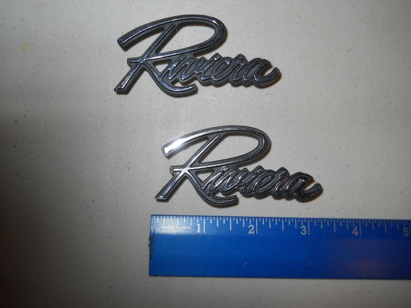 A pair of 1970 buick riviera b pillar "riviera" name plates.