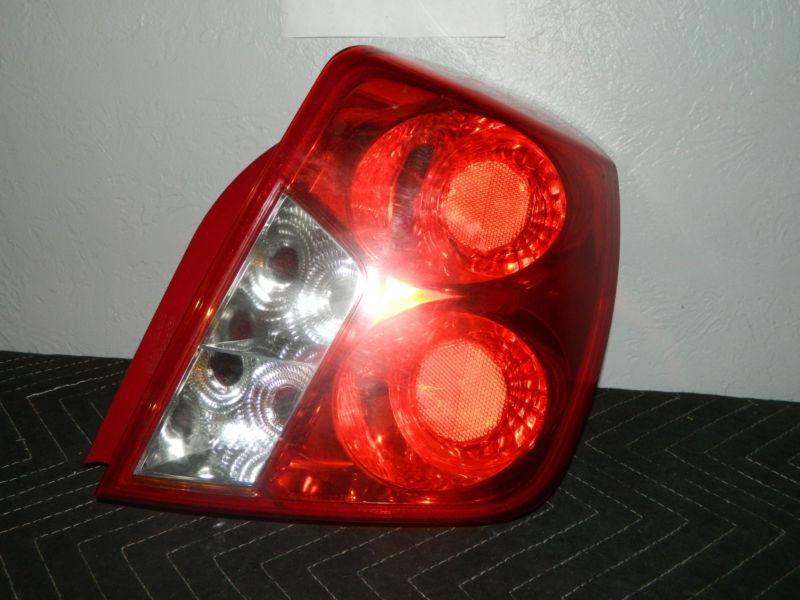Oem 2004-2007 chevy optra right /  passenger side tail light assembly 