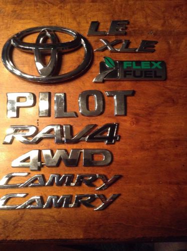 9 assorted car  emblems. used