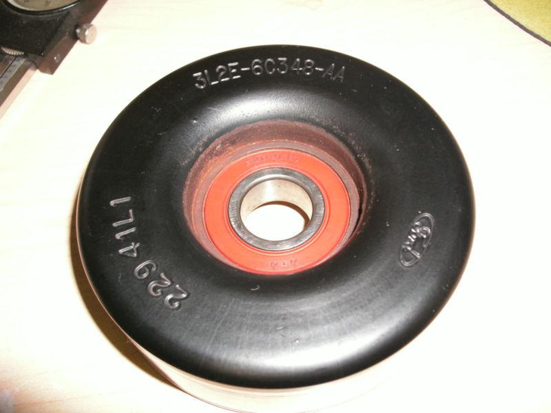 Used oem ford accessory belt idler pulley 3l2e6c348aa 45975 fits many others