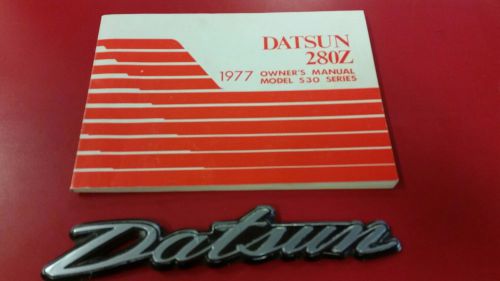 Original 1977 datsun 280z owner&#039;s manual s30 mint and datsun rear emblem 280 z
