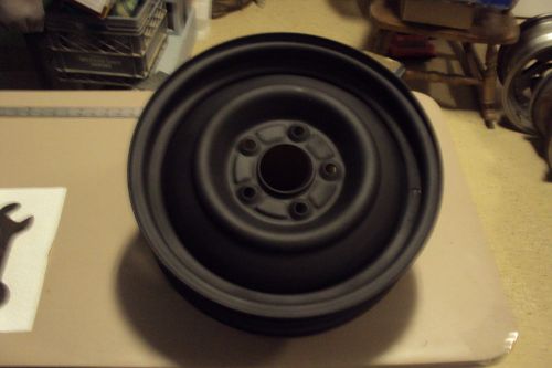 Vintage -  gm  15&#034;x 4&#034; steel wheel. old - never used, usa made.
