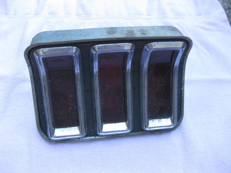 Origional 1967 ford mustang tail light and 1967  grill emblem spears