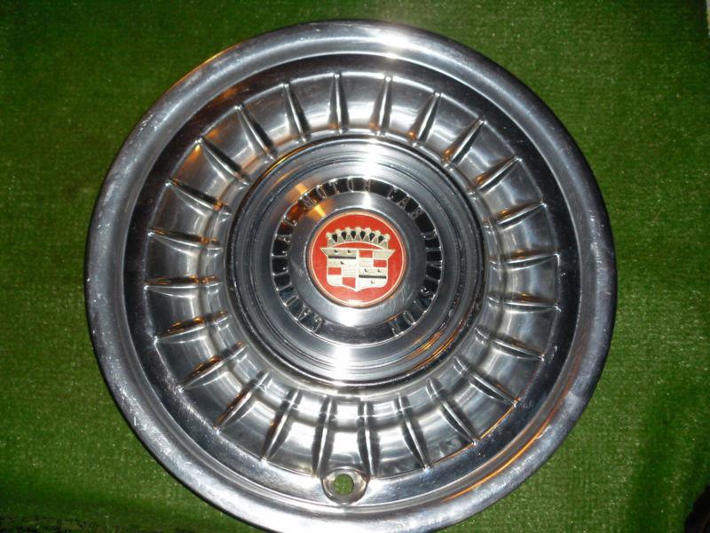 1958 cadillac hubcap (one only)